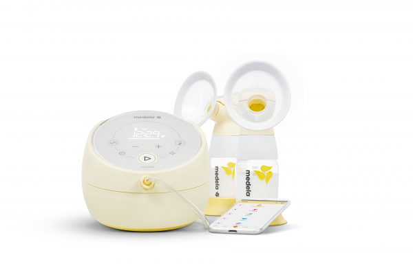 Medela Sonata Breast Pump with bottles and mobile phone
